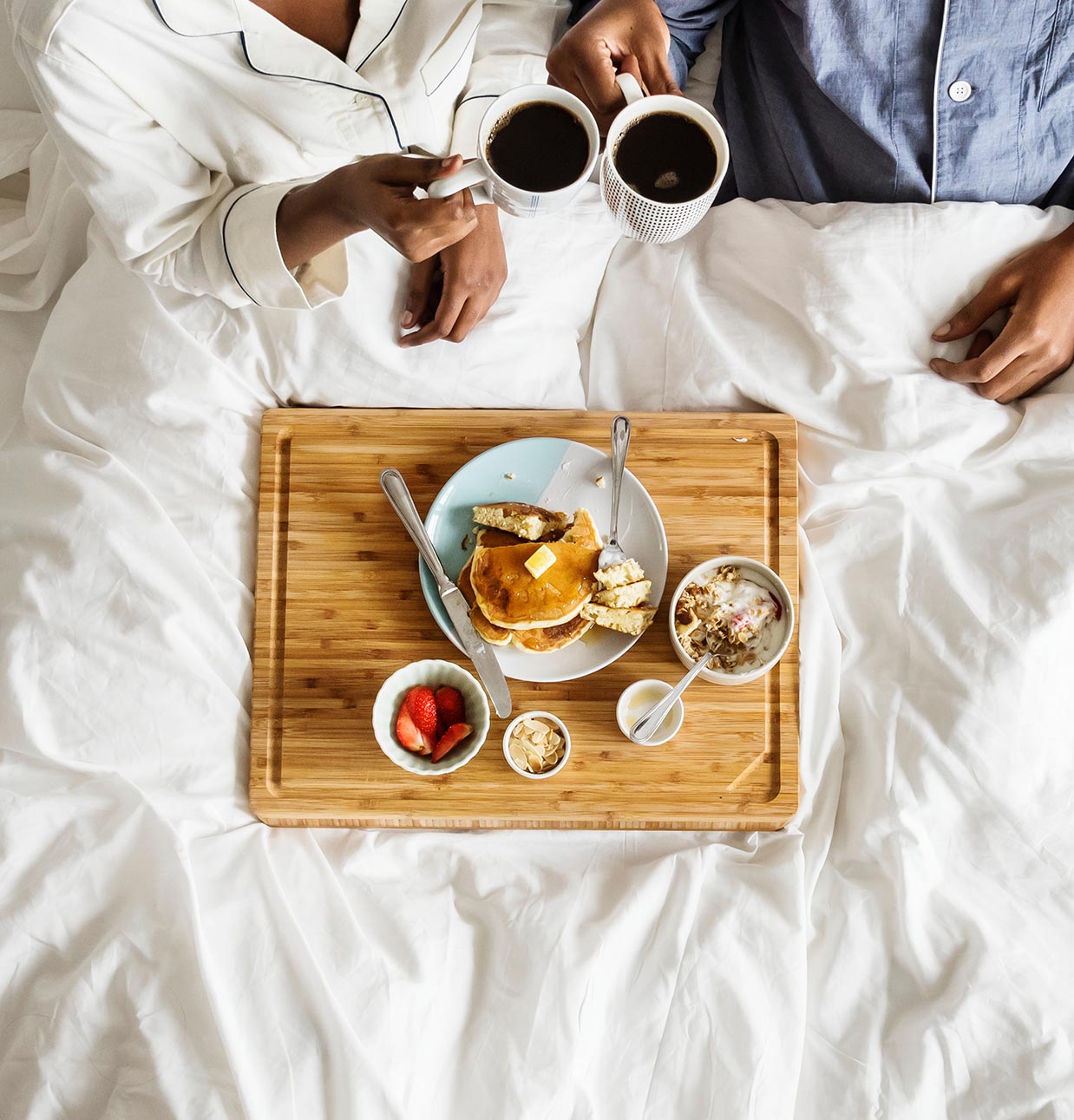 Couple having Breakfast in Bed